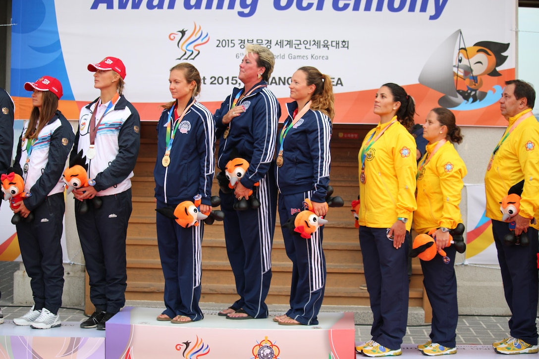 USA captures gold in the Women's Sailing two-person dinghy competition of the 6th Conseil International du Sport Militaire (CISM) in Mungyeong, South Korea 2-11 October.  U.S. Women from left to right: Navy Ensign Mary Hall (skipper); Ms. Sharkie Stielper (team captain) and Navy Lt. Trisha Kutkiewicz (crew). The U.S. took gold for the first time since 2005, outscoring Russia by one point. 