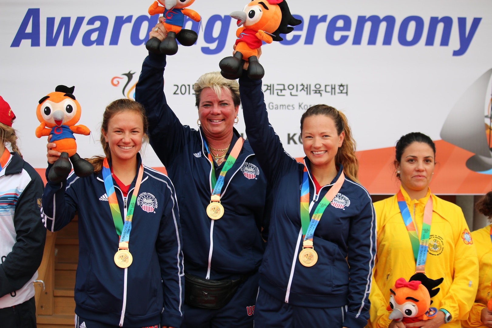 U.S. Women's Sailing Team capture the gold medal over Russia during the 6th Conseil International du Sport Militaire (CISM) Military World Games in Pohang, South Korea 2-11 October.  Skipper Navy Ensign Mary Hall (left) and crewmember Navy Lieutenant Trisha Kutkiewicz earned placed higher in 11 races, defeating Russia by one point.  The U.S. Women's Sailing team was the first official medal of the World Games for the U.S.