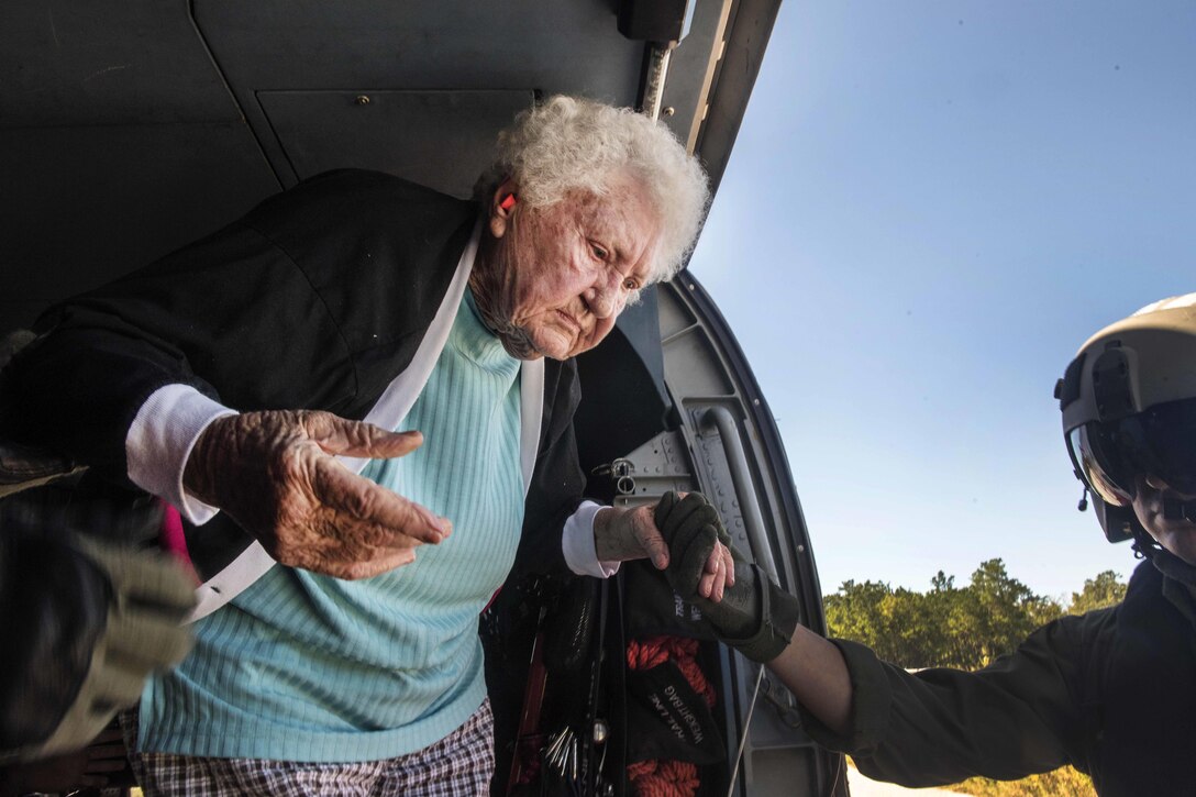 An 88-year-old woman is evacuated by a Coast Guard helicopter aircrew in Andrews, S.C., Oct. 7, 2015. U.S. Coast Guard photo by Petty Officer 1st Class Stephen Lehmann 