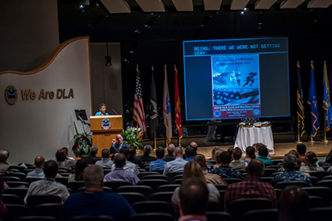 Mitch Guess, guest speaker at the POW/MIA event, shares some of the challenges her family grappled with during the repatriation of her father, former MIA US Air Force Colonel (Ret) Francis McGouldrick, Jr.