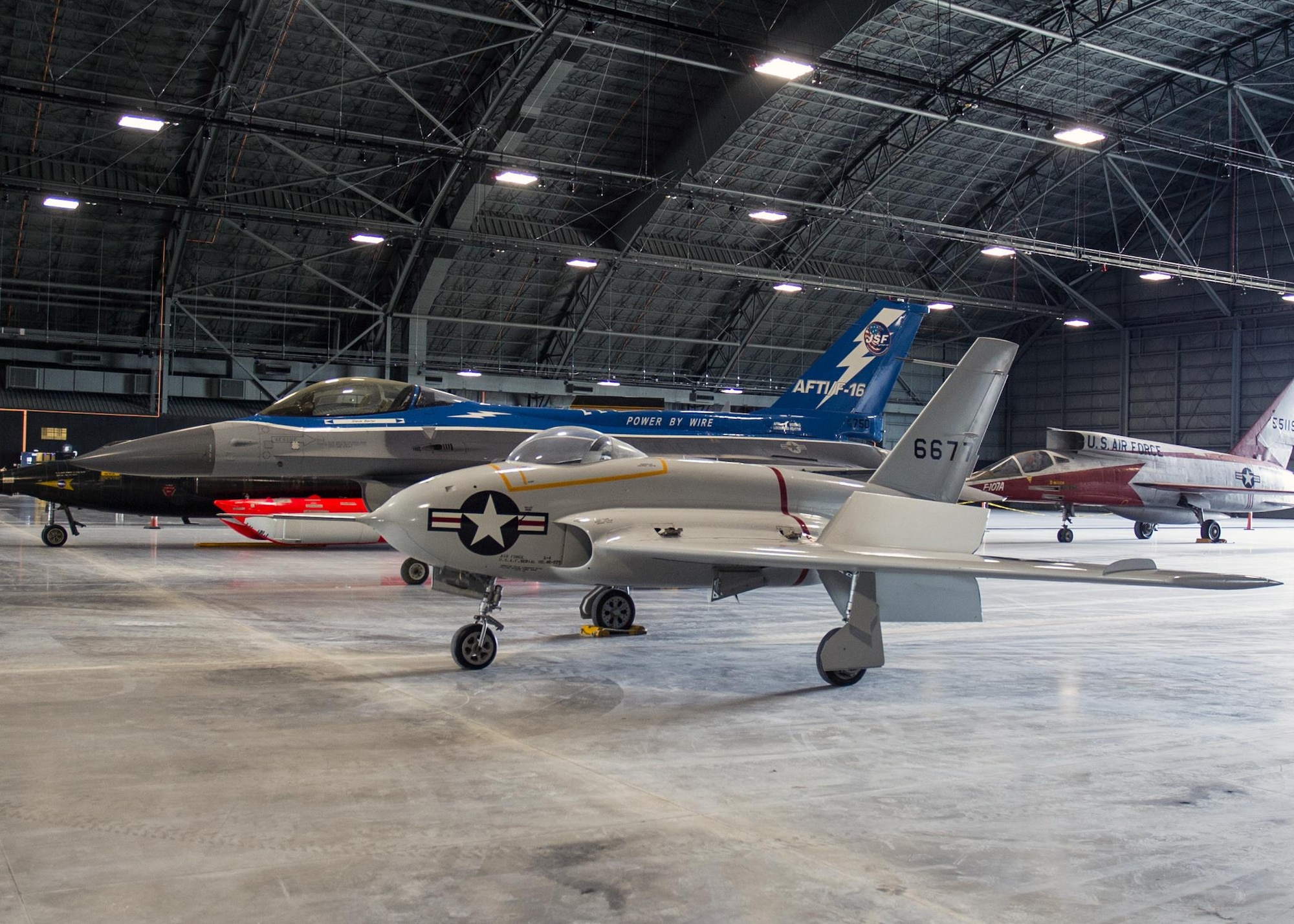 Restoration staff move the Northrop X-4 into the new fourth building at the National Museum of the U.S. Air Force on Oct. 6, 2015. (U.S. Air Force photo by Ken LaRock)