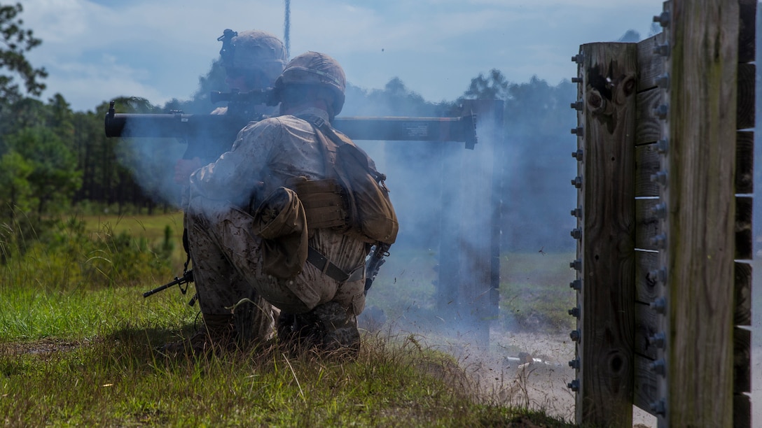 A Marine with 2nd Combat Engineer Battalion fires an 83mm high-explosive round downrange during a live-fire range at Camp Lejeune, North Carolina, Sept. 29, 2015. Approximately 30 Marines with the battalion fired the MK153 Shoulder-launched Multipurpose Assault Weapon to familiarize themselves with the weapons system for an upcoming deployment.
