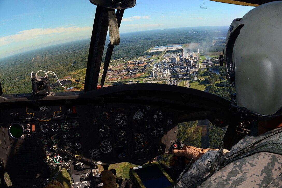 Army 1st Lt. T.J. Rose flies a CH-47 Chinook helicopter during a statewide flood response effort in South Carolina, Oct. 6, 2015. Rose is a pilot assigned to Detachment 1, 2nd Battalion, 238th Aviation Regiment, South Carolina Army National Guard. South Carolina National Guard photo by Air Force Airman Megan Floyd