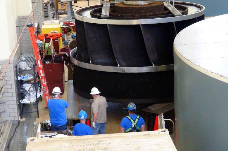 A Voith Hydro work crew supervises the placement of the turbine runner from hydropower unit two onto a stand in the power house at Center Hill Dam Oct. 7, 2015. The U.S. Army Corps of Engineers Nashville District is rehabbing all three units at the dam.