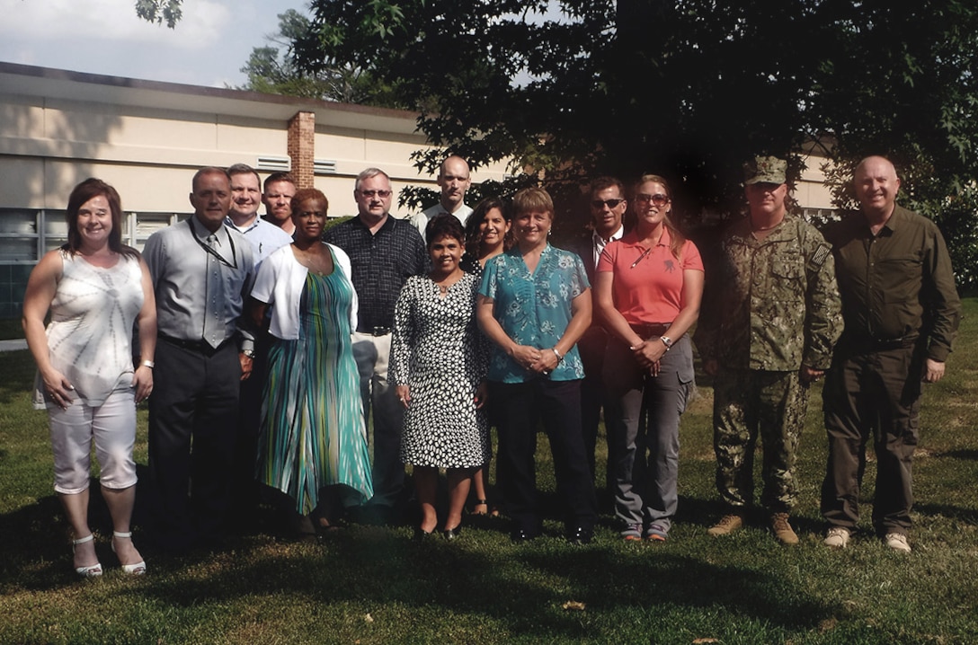 Members of the Joint Contingency Acquisition Support Office, part of Defense Logistics Agency Logistics Operations, pose for a photo before kicking off weeklong training for 24 new contingency contracting officers. 
