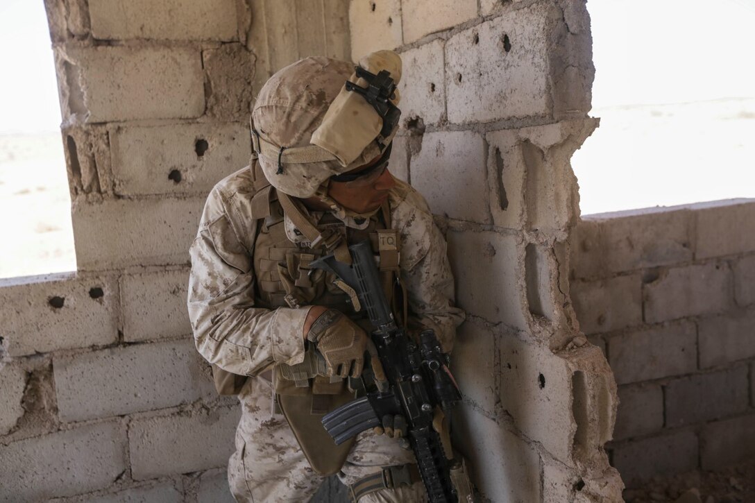 U.S. 5TH FLEET AREA OF OPERATIONS (Sept. 30, 2015)  U.S. Navy Hospital Corpsman 2nd Class Devin McGuire with India Company, Battalion Landing Team 3rd Battalion, 1st Marine Regiment, 15th Marine Expeditionary Unit, provides security during a military operations in urban terrain exercise. The 15th MEU, embarked aboard the ships of the Essex Amphibious Ready Group, is a forward-deployed, flexible sea-based Marine air-ground task force capable of engaging with regional partners and maintaining regional security.  (U.S. Marine Corps photo by Sgt. Jamean Berry/Released)