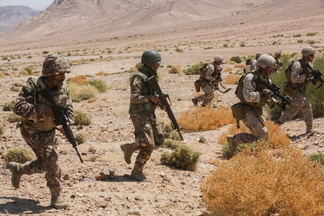U.S. 5TH FLEET AREA OF RESPONSIBILITY (Aug. 25, 2015) Jordanian Soldiers and U.S. Marines with India Company, Battalion Landing Team 3rd Battalion, 1st Marine Regiment, 15th Marine Expeditionary Unit, move to their next firing position during a bilateral training exercise. The 15th MEU is deployed throughout the U.S. 5th Fleet area of responsibility to maintain regional security. (U.S. Marine Corps photo by Sgt. Jamean Berry/Released)