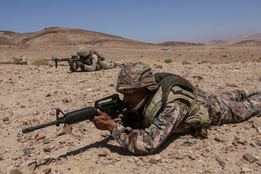 U.S. 5TH FLEET AREA OF RESPONSIBILITY (Aug. 25, 2015) Jordanian Soldiers and U.S. Marines with India Company, Battalion Landing Team 3rd Battalion, 1st Marine Regiment, 15th Marine Expeditionary Unit, provide security during a bilateral training exercise. The 15th MEU is deployed throughout Southwest Asia to maintain regional security in the U.S. 5th Fleet area of responsibility. (U.S. Marine Corps photo by Sgt. Jamean Berry/Released)