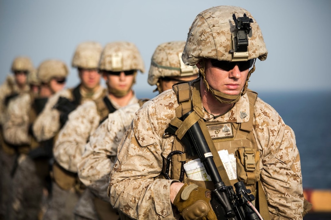 ARABIAN GULF (Oct. 7, 2015) U.S. Marines with India Battery, Battalion Landing Team 3rd Battalion, 1st Marine Regiment, 15th Marine Expeditionary Unit, prepare for a pivoting drill during a deck shoot aboard the amphibious assault ship USS Essex (LHD 2). The Marines practiced different pivoting drills as well as shooting on the move in order to enhance their marksmanship skills. The 15th MEU, embarked aboard the ships of the Essex ARG, is deployed to maintain regional security in the U.S. 5th Fleet area of operations. (U.S. Marine Corps photo by Cpl. Anna Albrecht/Released)