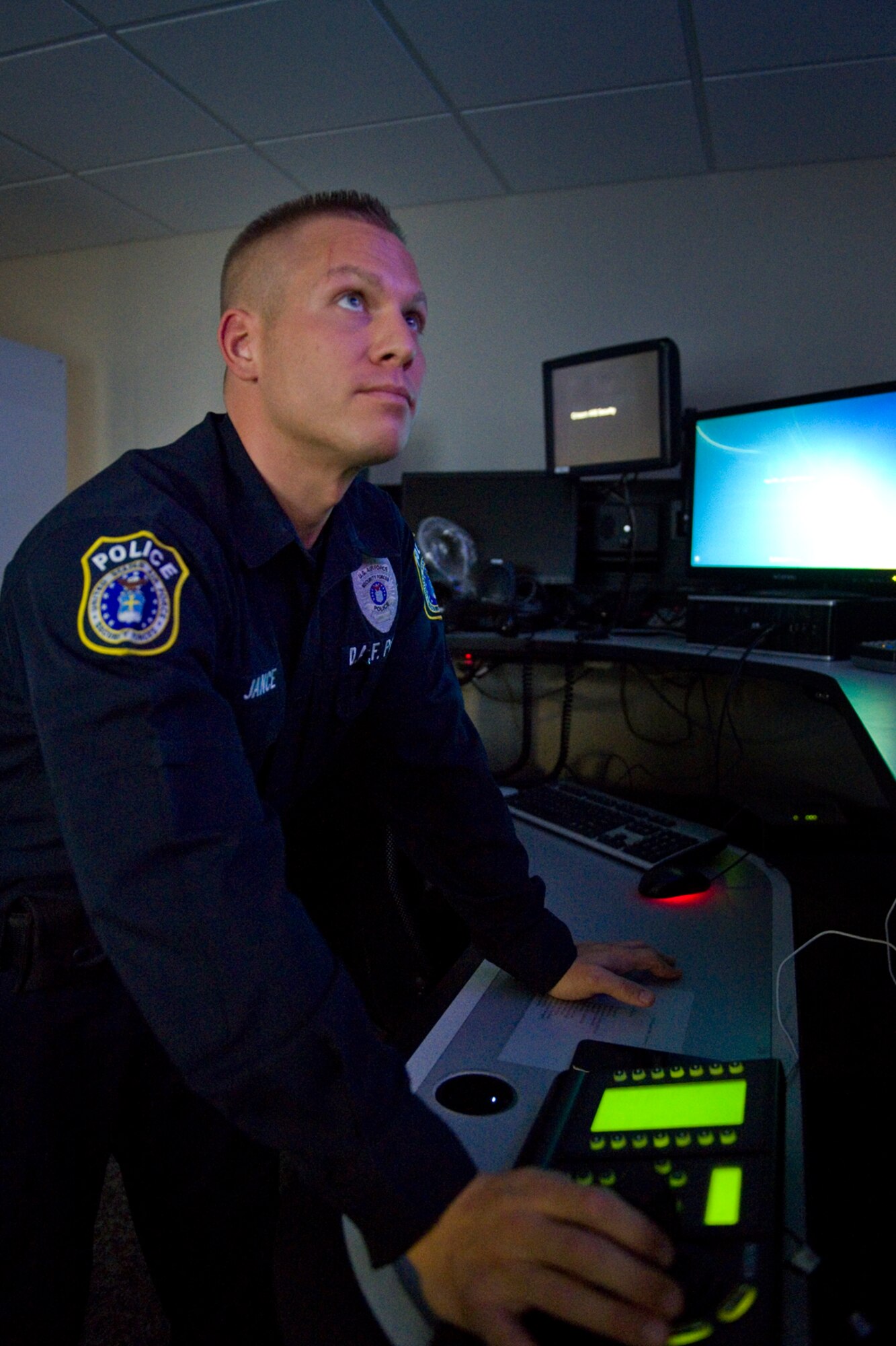 Chris Jance, 434th Security Forces Squadron Department of the Air Force police officer, monitors surveillance cameras during his shift at Grissom Air Reserve Base, Ind., Sept. 29, 2015. With over 1,200 acres of land, more than two billion dollars of real property and 16 KC-135R Stratotanker’s valued at approximately fifty-two million dollars each, the 434th Security Forces Squadron plays a vital role protecting Grissom’s resources. (U.S. Air Force Photo/Tech. Sgt. Benjamin Mota)