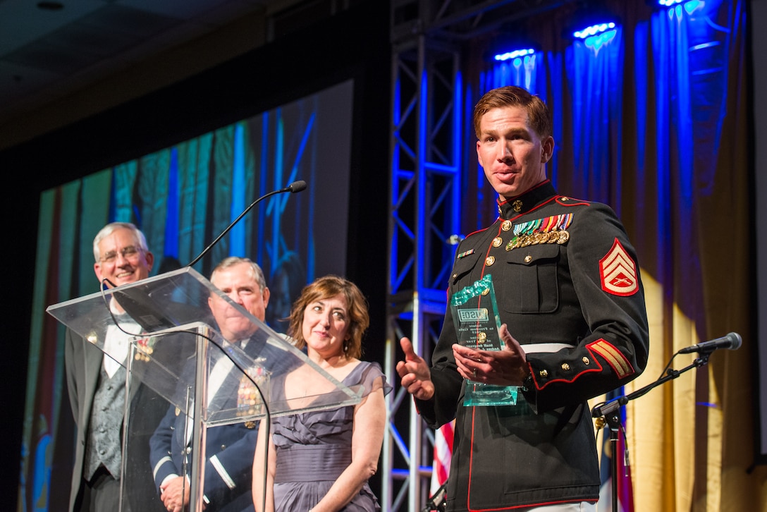 Staff Sgt. Andres Rodriguez gives his acceptance speech after being named the USO North Carolina Marine of the Year at the 2015 Annual Salute to Freedom Gala in Durham, N.C., Oct. 3, 2015. Congressman David Price, 4th District of NC presented each honoree with The U.S. flag flown over the Capitol in Washington DC.

