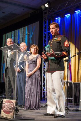 Staff Sgt. Andres Rodriguez gives his acceptance speech after being named the USO North Carolina Marine of the Year at the 2015 Annual Salute to Freedom Gala in Durham, N.C., Oct. 3, 2015. Congressman David Price, 4th District of NC presented each honoree with The U.S. flag flown over the Capitol in Washington DC.
