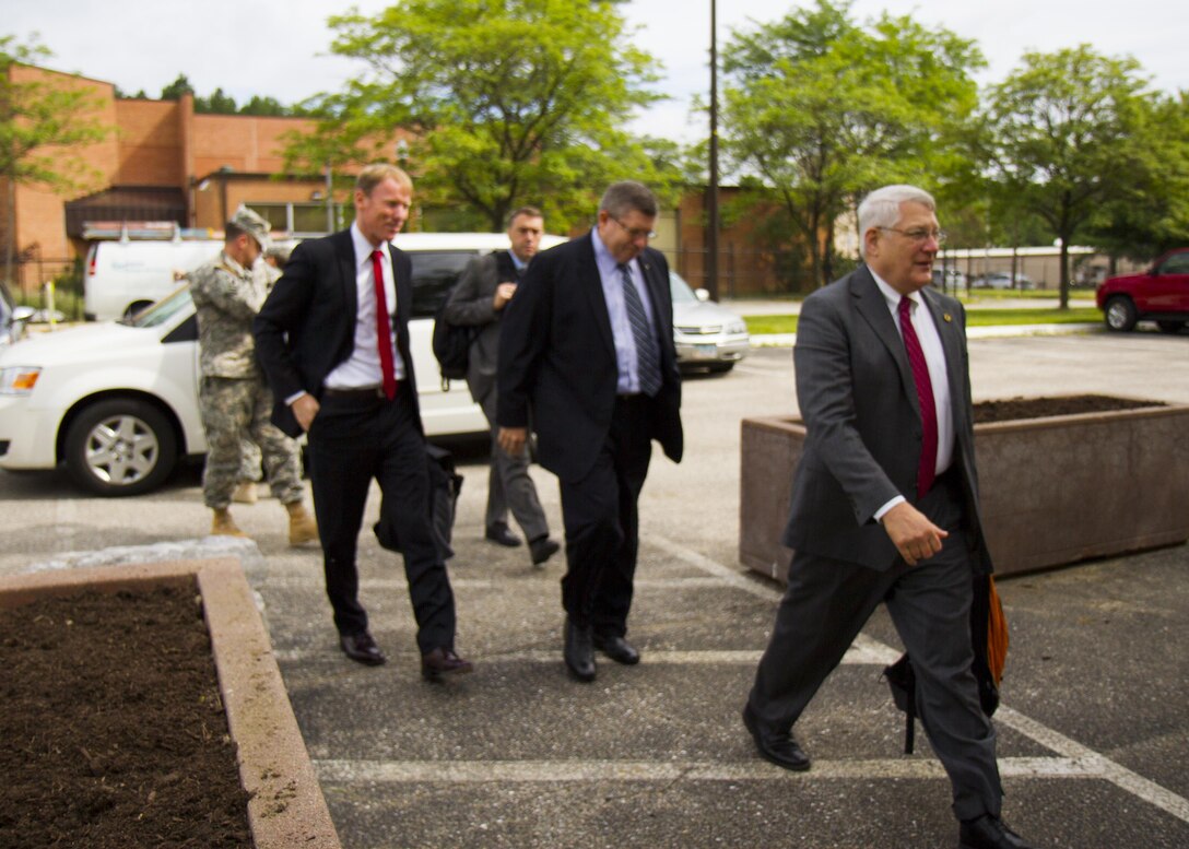 Retired Army Gen. Carter Ham, chairman of the National Commission on the Future of the Army, leads an NCFA delegation into the 200th Military Police Command headquarters July 14, 2015, at Fort Meade, Md. The commission is tasked with making recommendations concerning component roles, force structure design, organization, employment and reserve forces policy. (U.S. Army Reserve Photo by Sgt. 1st Class Jacob Boyer/RELEASED)