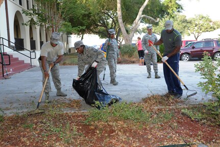 Air Force Recruiting Service personnel rake leaves at the AFRS headquarters building during Joint Base San Antonio’s Proud Week Oct. 8, 2015 at JBSA-Randolph. Proud Week gives JBSA members an opportunity to pause from daily operations and focus on maintaining a high beautification standard throughout JBSA. (U.S. Air Force photo by Joel Martinez/Released) 