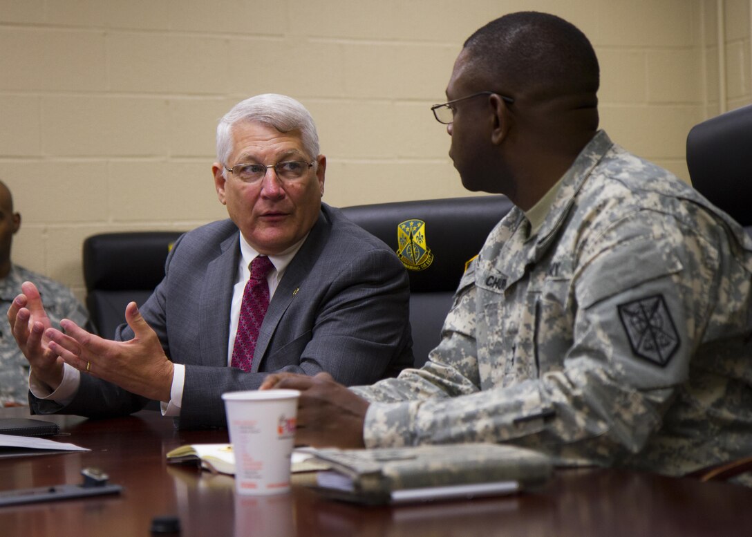 Retired Army Gen. Carter Ham, chairman of the National Commission on the Future of the Army, leads an NCFA delegation into the 200th Military Police Command headquarters July 14, 2015, at Fort Meade, Md. The commission is tasked with making recommendations concerning component roles, force structure design, organization, employment and reserve forces policy. (U.S. Army Reserve Photo by Sgt. 1st Class Jacob Boyer/RELEASED)