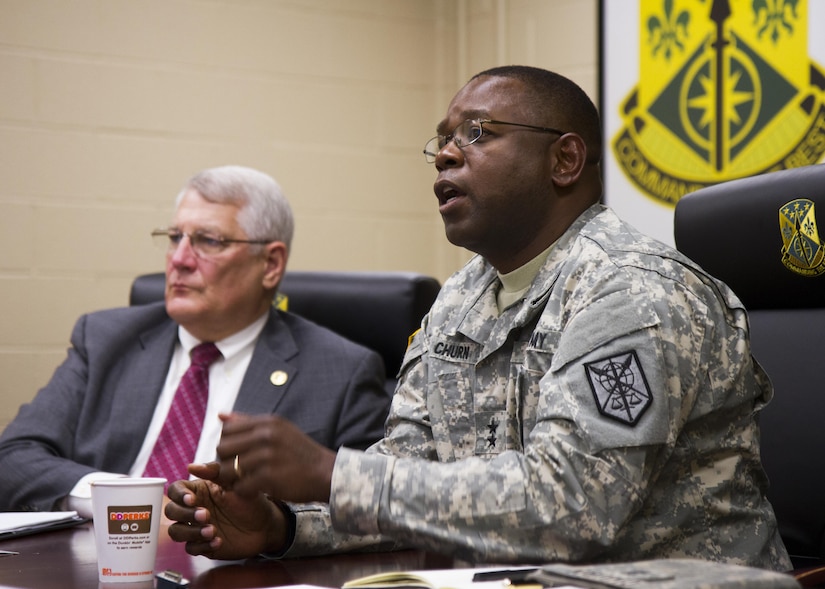 Army Maj. Gen. Phillip Churn, commander of the Army Reserve's 200th Military Police Command, discusses reserve operations with retired Army Gen. Carter Ham, chairman of the National Commission on the Future of the Army, July 14, 2015, at Fort Meade, Md. The commission is tasked with making recommendations concerning component roles, force structure design, organization, employment and reserve forces policy. (U.S. Army Reserve Photo by Sgt. 1st Class Jacob Boyer/RELEASED)