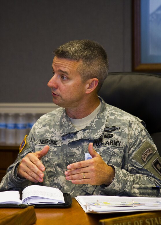 Army Col. Tim Newsome, 1st Army Division East chief of staff, discusses reserve component training with National Commission on the Future of the Army members July 14, 2015, at Fort Meade, Md. The commission is tasked with making recommendations concerning component roles, force structure design, organization, employment and reserve forces policy. (U.S. Army Reserve Photo by Sgt. 1st Class Jacob Boyer/RELEASED)