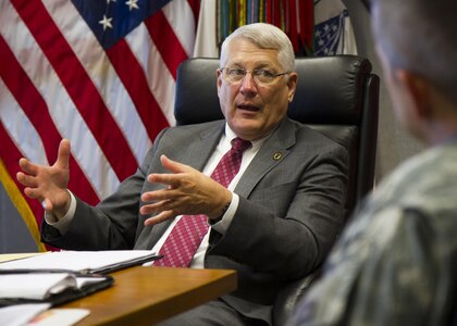 Retired Army Gen. Carter Ham, chairman of the National Commission on the Future of the Army, asks a question about reserve component training July 14, 2015, at Fort Meade, Md. The commission is tasked with making recommendations concerning component roles, force structure design, organization, employment and reserve forces policy. (U.S. Army Reserve Photo by Sgt. 1st Class Jacob Boyer/RELEASED)