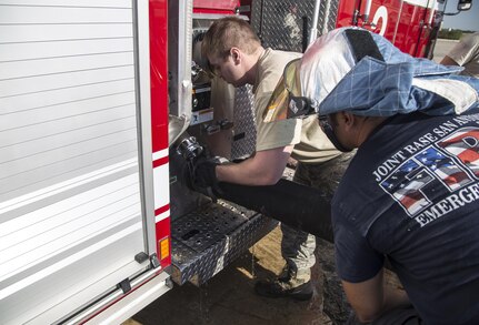 Senior Airman Ryan O’Grady, 502nd Civil Engineer Squadron firefighter, attaches a draft hose to a fire engine during training Oct. 1 at Joint Base San Antonio-Randolph. The core missions of 502nd CES firefighters are to protect their team, others, property and the environment while responding to aircraft, structural and medical emergencies.