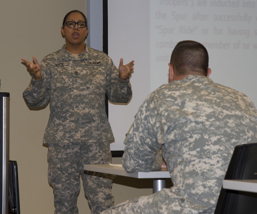 Sgt. 1st Class Kisha S. White, 75th Training Command, gives a presentation about bullying and harrasment within the military July 15, 2015, at Farmingdale, N.Y.  The Equal Opportunity Leaders Course is designed to provide leaders at battalion and company levels the critical skills needed to assist commanders, military personnel and family members with all the matters concerning equality and diversity in the organization. (U.S. Army Reserve Photo by Spc. Stephanie Ramirez/ RELEASED)