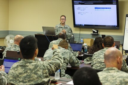 Chief Warrant Officer 2 Charles Farran, senior food adviser at the 200th Military Police Command conducts a four-day food service training July 28-31. Participants learned United States Army Reserve Command food service policy procedures. (US Army photo taken by Sgt. Elizabeth Taylor/Released)