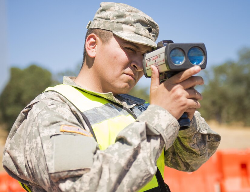 U.S. Army Spc. Daniel Rodriguez, a military police officer with the 382nd Military Police Detachment from San Diego, monitors traffic with a speed detection device at Fort Hunter Liggett, Calif., Aug. 1. Rodriguez, a Downey, Calif., native, worked with Fort Hunter Liggett police to maintain law and order, and force protection during his annual training, July 26- Aug. 10. The 382nd supported WAREX 91-15, “Operation Caucasus Restore.” WAREX 91-15 prepares Reserve and National Guard units with real world and scenario based training, as well as basic Soldier skills during the exercise. (Photo by U.S. Army Staff Sgt. Nazly Confesor, 200th MP Command Public Affairs/Released)