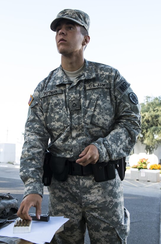 U.S. Army Pfc. Stephen Pittman, a military police officer with the 382nd Military Police Detachment from San Diego, loads ammunition into his weapon at Fort Hunter Liggett, Calif., Aug. 1. Pittman, a Carlsbad, Calif., native worked with Fort Hunter Liggett police to maintain law and order and force protection during their annual training, July 26 - Aug. 10. (Photo by U.S. Army Staff Sgt. Nazly Confesor, 200th MP Command Public Affairs/Released)