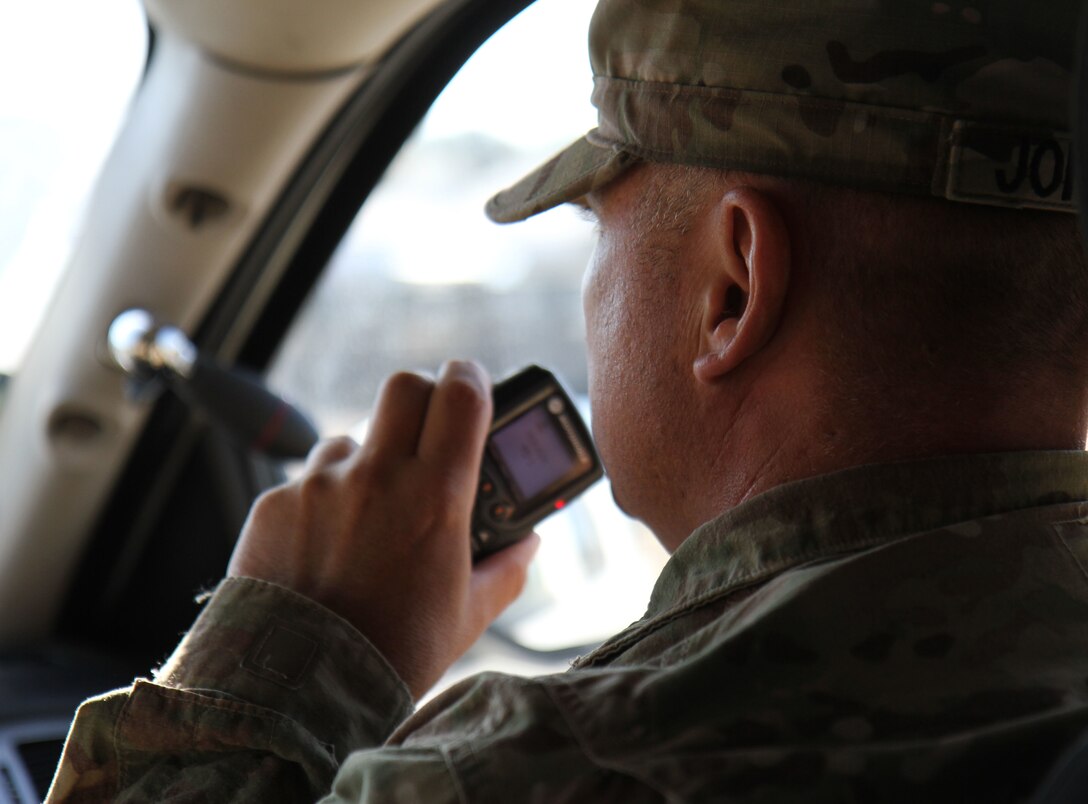 U.S. Army Sgt. Kenneth Johnson, a military police officer with the 382nd Military Police Detachment from San Diego, speaks over the patrol radio during a law and order mission at Fort Hunter Liggett, Calif., Aug. 1. Johnson, a Tucson, Ariz., native, worked with Fort Hunter Liggett police to maintain law and order and force protection during his annual training, July 26 - Aug. 10. The 382nd supported WAREX 91-15, “Operation Caucasus Restore.” WAREX 91-15 prepares Reserve and National Guard units with real world and scenario based training, as well as basic Soldier skills during the exercise. (Photo by U.S. Army Staff Sgt. Nazly Confesor, 200th MP Command Public Affairs/Released)