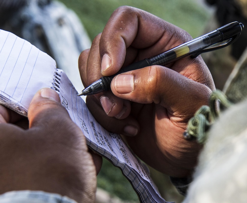 A U.S. Army military police officer with the 382nd Military Police Detachment from San Diego, takes notes at a morning briefing at the Fort Hunter Liggett Provost Marshal Office, Calif., Aug. 1. The 382nd supported WAREX 91-15, “Operation Caucasus Restore.” WAREX 91-15 prepares Reserve and National Guard units with real world and scenario based training, as well as basic Soldier skills during the exercise. (Photo by U.S. Army Staff Sgt. Nazly Confesor, 200th MP Command Public Affairs/Released)