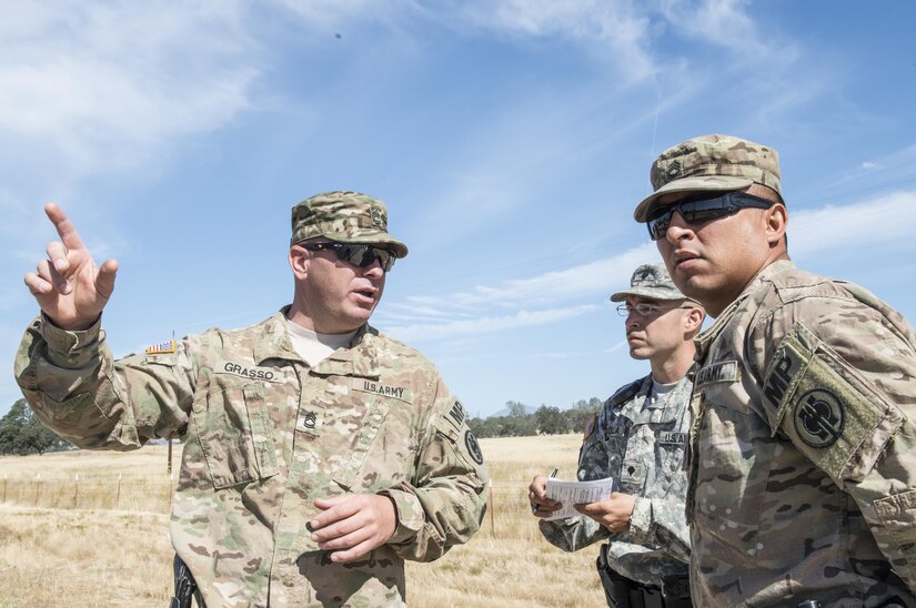 U.S. Army Sgt. 1st Class, Mark Grasso (left), with the 382nd Military Police Detachment, San Diego, gives instructions to military police officers Spc. Juan Padilla (center) from the 382nd Military Police Detachment and Staff Sgt. Daniel Vasquez (right), from the 491st Military Police Company, Riverside, Calif., at Fort Hunter Liggett, Calif., Aug. 3. Grasso, Padilla and Vasquez worked with Fort Hunter Liggett police to maintain law and order, and force protection during their annual training, July 26- Aug. 10. The 382nd supported WAREX 91-15, “Operation Caucasus Restore.” WAREX 91-15 prepares Reserve and National Guard units with real world and scenario based training, as well as basic Soldier skills during the exercise. (Photo by U.S. Army Staff Sgt. Nazly Confesor, 200th MP Command Public Affairs/Released)