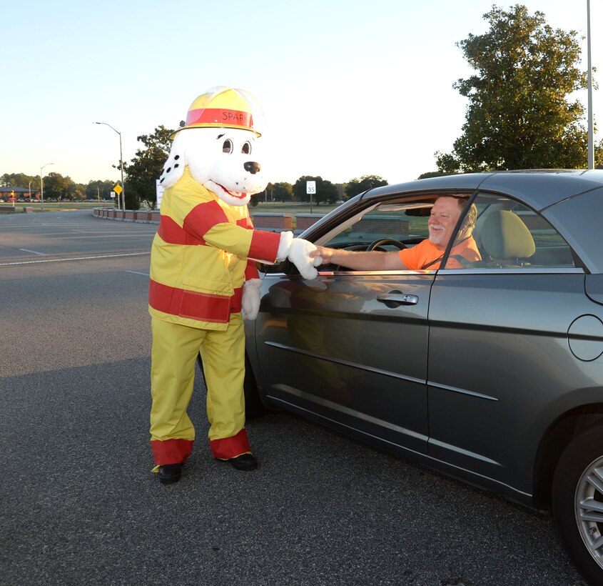 Marine Corps Logistics Base Albany’s Sparky the Fire Dog greets personnel and visitors to the installation, Oct. 7. Fire safety officials posted Sparky at the Main Gate to heighten awareness and to commemorate Fire Prevention Week activities, which are currently underway.

