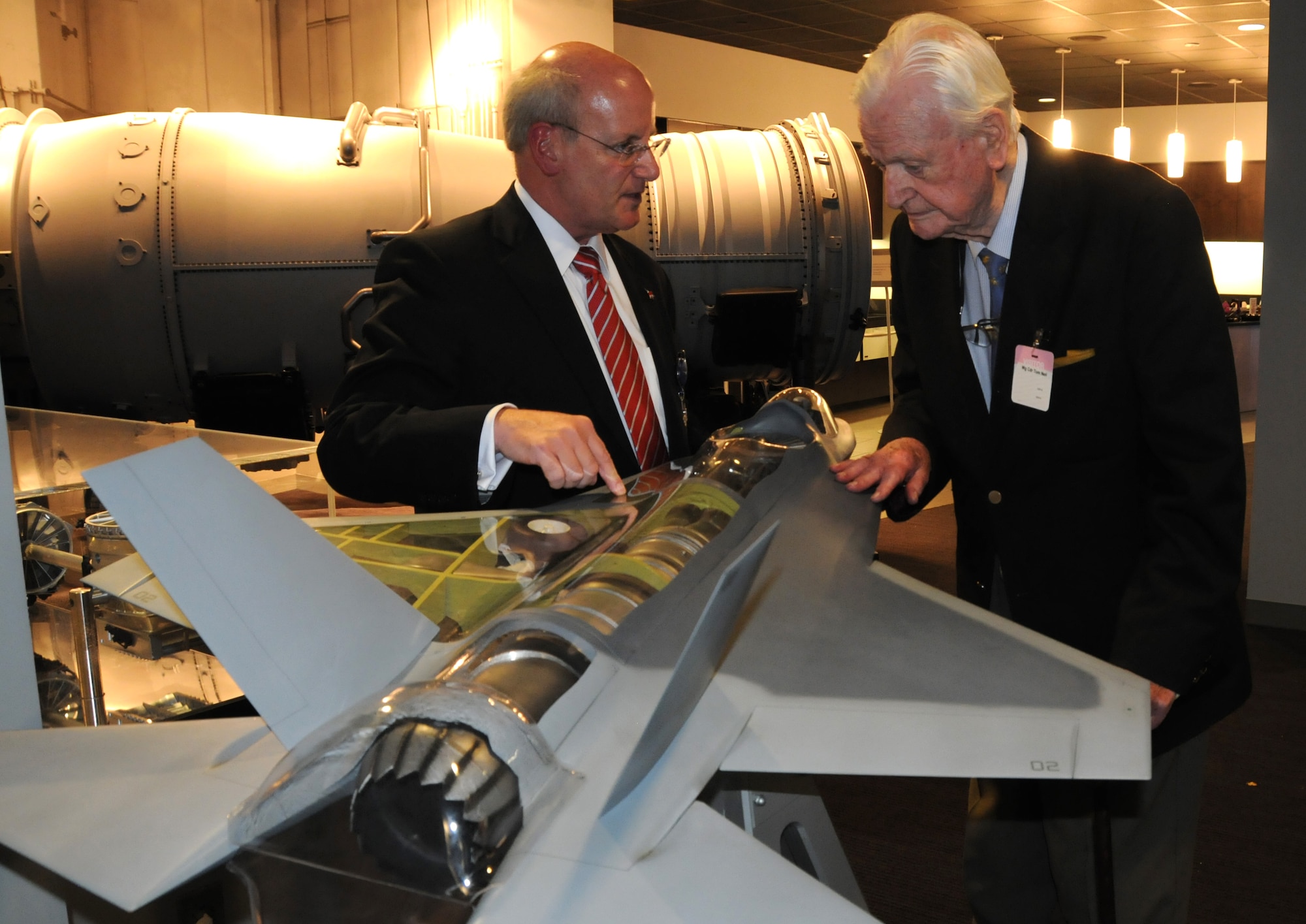Michael Otterblad, director of international programs at Lockheed Martin, discusses the capabilities of the F-35 fighter jet with Tom “Ginger” Neil, a renowned flying ace, inside the corporation’s office in Arlington, Va., on Oct. 7, 2015. (U.S. Air Force photo/Sean Kimmons)