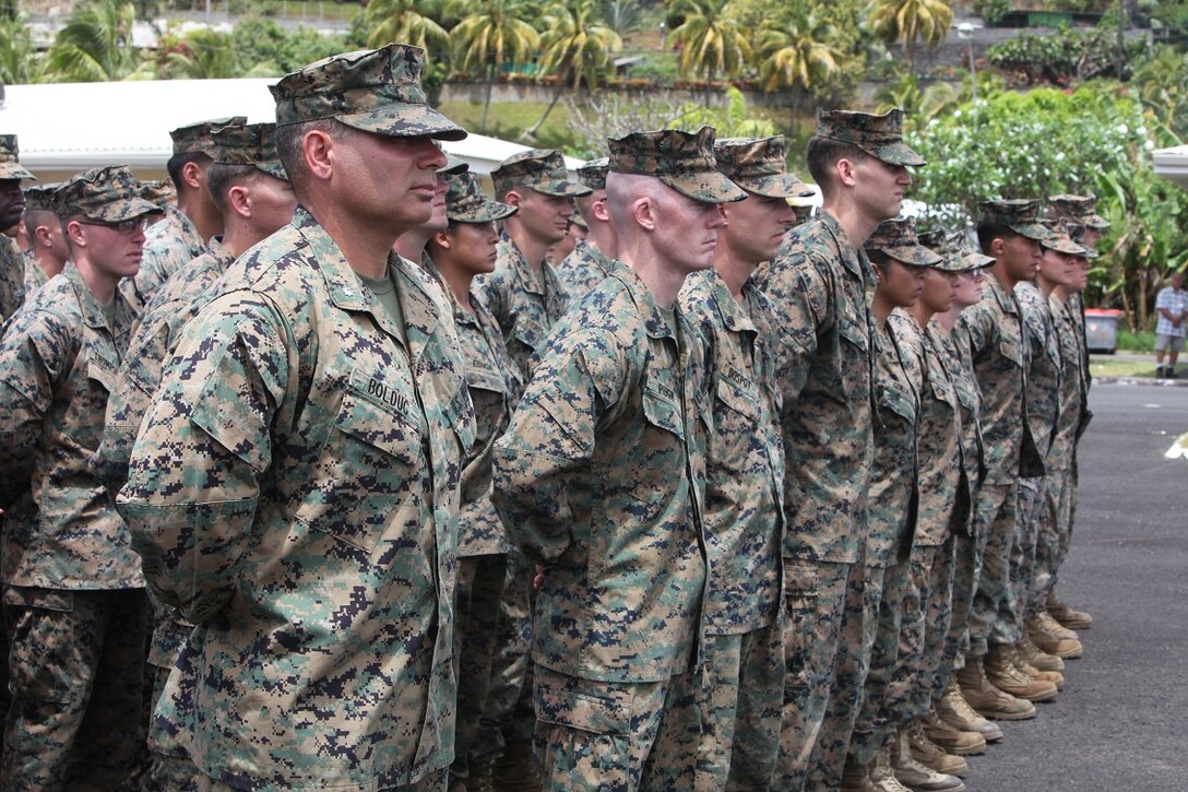 Lt Col. Demetrius Bolduc, commanding officer for Koa Moana 15-3, stands in formation beside his Marines during the closing ceremony in Tahiti, Oct. 2. Marines shared warfighting techniques and tactics with their French counterparts and participated in local cultural events.