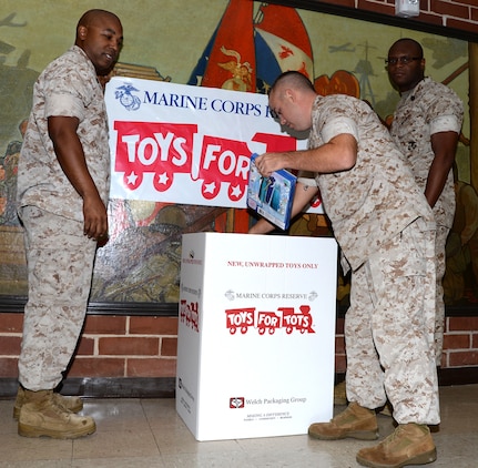 The 2015 U.S. Marine Corps Reserve Toys for Tots Program’s annual campaign is underway. Gunnery Sgt. Alvin L. Payne (left), Gunnery Sgt. Jimmie Smith (center) and Petty Officer 1st Class Derrek Surrett are collecting new, unwrapped toys for less fortunate children at various locations throughout the base and surrounding Albany communities.