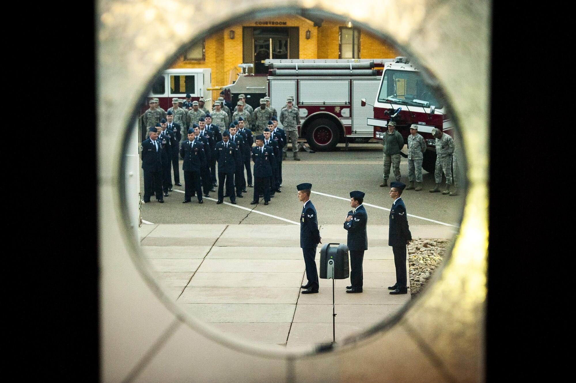 Cannon firefighters assigned to the 27th Special Operations Civil Engineering Squadron, prepare for the raising of the flag to half-staff during a ceremony dedicated to the fallen firefighters, Oct. 04, 2015 at Cannon Air Force Base, N.M. The ceremony was in observance of Bells Across America, a day dedicated to paying tribute to fellow firefighters who gave their life in the service of others. (U.S. Air Force photo/Tech. Sgt. Manuel J. Martinez)