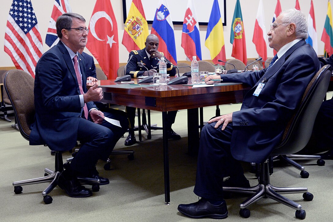 U.S. Defense Secretary Ash Carter speaks with Turkish Defense Minister Vecdi Gonul at NATO headquarters in Brussels, Oct. 8, 2015. Carter is on a five-day trip to Europe to attend the NATO Defense Ministerial in Brussels, and meet with counterparts in Spain, Italy and the United Kingdom. DoD photo by U.S. Army Sgt. 1st Class Clydell Kinchen

