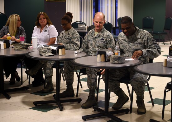 ALTUS AIR FORCE BASE, Okla. – U.S. Air Force Col. Charles Ohliger, 97th Air Mobility Wing vice commander, and Chief Master Sgt. James Powell III, 97th AMW command chief master sergeant, talk during the 2015 Combined Federal Campaign breakfast at the Galaxy Grill, Oct. 8. There are more than 20,000 charities available through the CFC and they are broken down into many different categories including, but not limited to: arts, education, animal related, health care, mental health and crisis intervention, medical research, crime and legal research, housing and shelter, recreation and sports, science and technology and religion-related. (U.S. Air Force photo by Airman 1st Class Megan E. Acs/Released) 