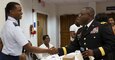Maj. Gen. Phillip M. Churn, the commanding general for the 200th Military Police Command, shakes the hand of Air Force ROTC cadet during the Student Leadership Conference at the Howard University School of Law in Washington, Aug. 29, 2015.  The conference focused on challenging graduate and undergraduate students to become leaders and change agents in society, Maj. Gen. Churn delivered the closing address at the ceremony.