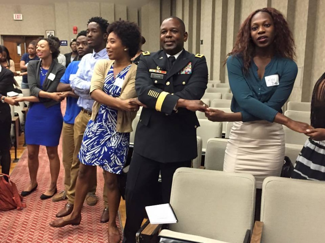 Maj. Gen. Phillip M. Churn, the commanding general for the 200th Military Police Command, joins the students at the Leadership Conference in the Howard University School of Law in Washington, as they sing their alma mater to conclude the conference Aug. 29, 2015.  The conference focused on challenging graduate and undergraduate students to become leaders and change agents in society, Maj. Gen. Churn delivered the closing address at the ceremony.