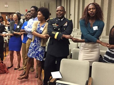 Maj. Gen. Phillip M. Churn, the commanding general for the 200th Military Police Command, joins the students at the Leadership Conference in the Howard University School of Law in Washington, as they sing their alma mater to conclude the conference Aug. 29, 2015.  The conference focused on challenging graduate and undergraduate students to become leaders and change agents in society, Maj. Gen. Churn delivered the closing address at the ceremony.