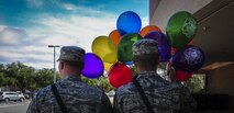 Airman 1st Class Nickolas Wales and Airman Guiliano Wright, 1st Special Operations Civil Engineer Squadron firefighters, prepare to hand out fire department balloons at the Base Commissary during Fire Prevention Week on Hurlburt Field, Fla., Oct. 4, 2015. Sparky the Fire Dog and Airmen with the Hurlburt Field Fire Department greet Airmen on base, visited Child Development Centers, the base library and other locations around base throughout the week to educate and raise awareness about fire prevention. This year’s theme is “Hear the BEEP, where you SLEEP: Every Bedroom Needs A Working Smoke Alarm!” Fire Prevention Week will conclude with a fire muster challenge open to Airmen around base, Oct. 9. (U.S. Air Force photo by Senior Airman Meagan Schutter)