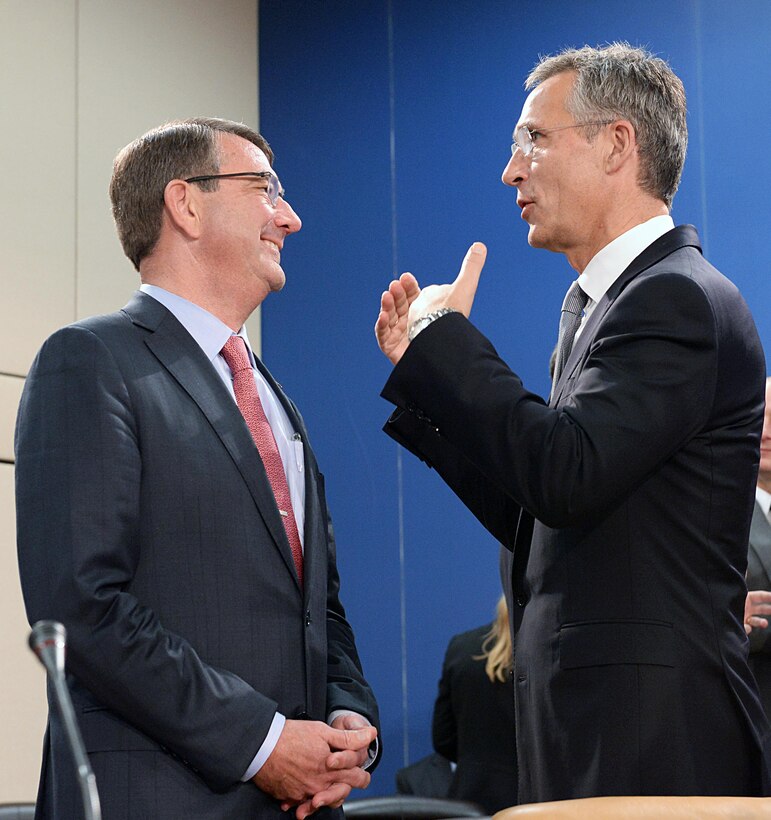 U.S. Defense Secretary Ash Carter and NATO Secretary General Jens Stoltenberg chat before the start of the meeting of the North Atlantic Council at NATO headquarters in Brussels, Oct. 8, 2015. Carter is on a five-day trip to Europe to attend the NATO Defense Ministerial in Brussels, and meet with counterparts in Spain, Italy and the United Kingdom. DoD photo by U.S. Army Sgt. 1st Class Clydell Kinchen
