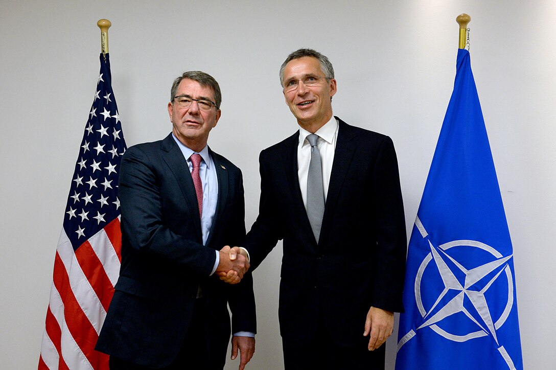 U.S. Defense Secretary Ash Carter, left, shakes hands with NATO Secretary General Jens Stoltenberg at NATO headquarters in Brussels, Oct. 8, 2015. Carter is on a five-day trip to Europe to attend the NATO Defense Ministerial in Brussels, and meet with counterparts in Spain, Italy and the United Kingdom. DoD photo by U.S. Army Sgt. 1st Class Clydell Kinchen

