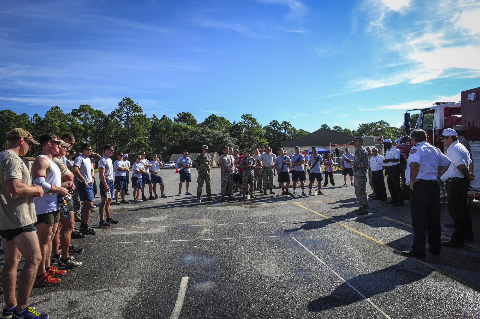 Col. Todd Fogle, 1st Special Operations Squadron Mission Support Group commander, delivers a closing speech to Airmen after this year's Fire Prevention Week fire muster challenge on Hurlburt Field, Fla., Oct. 8, 2015. Sparky the Fire Dog, National Fire Prevention Association spokesdog, and Airmen with the Hurlburt Field Fire Department welcomed Airmen on base, visited Child Development Centers, the base library and other locations around base throughout the week to educate and raise awareness about fire prevention. This year’s theme is “Hear the BEEP, where you SLEEP: Every Bedroom Needs A Working Smoke Alarm!” Fire Prevention Week concluded with a fire muster challenge that was open to Hurlburt Airmen. (U.S. Air Force photo by Senior Airman Meagan Schutter)