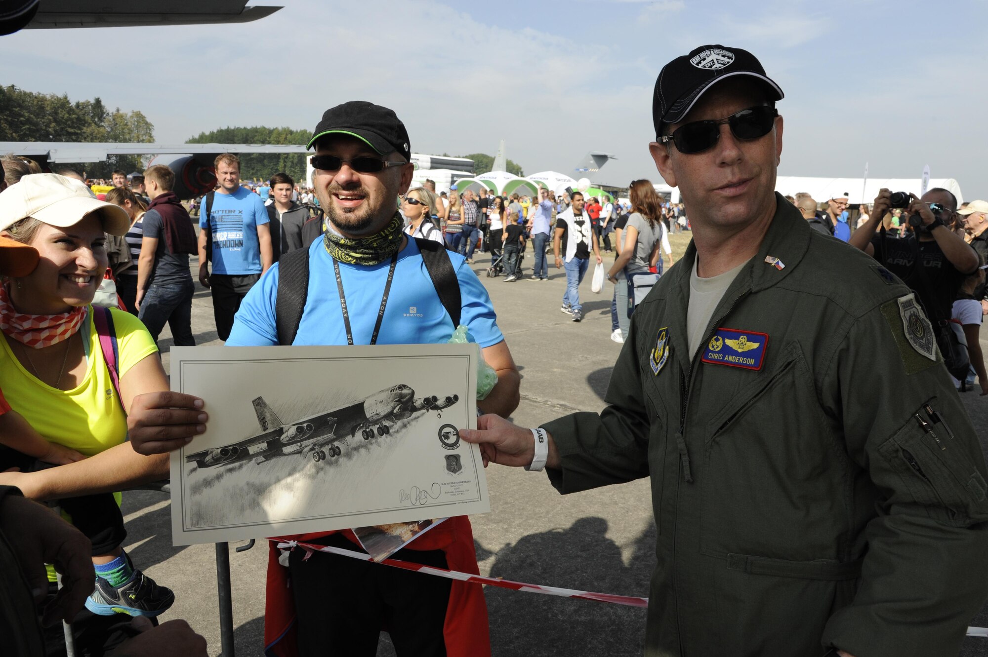 U.S. Air Force Lt. Col. Chris Anderson, the 307th Operations Support Squadron commander, shows a drawing of a B-52 Stratofortress at the NATO Days 2015 air show at Ostrava, Czech Republic. An attendee brought the drawing to have the aircrew autograph it. The air show was attended by over 225,000 people from Sept. 19-20. (Photo courtesy of U.S. Air Force Capt. Kerry Baker/Released)