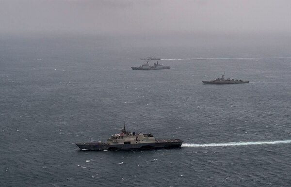 151002-N-MK881-291 BAY OF BENGAL (Oct. 1, 2015) Ships from the Bangladesh and U.S. navies gather in formation during Cooperation Afloat Readiness and Training (CARAT) Bangladesh 2015. CARAT is an annual, bilateral exercise series with the U.S. Navy, U.S. Marine Corps and the armed forces of nine partner nations. (U.S. Navy photo by Mass Communication Specialist 2nd Class Joe Bishop/Released)
