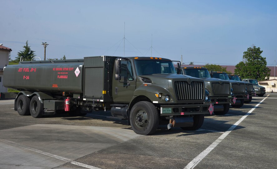 Fuel trucks sit parked in the 374th Logistics Readiness Squadron fuels management flight parking lot at Yokota Air Base, Japan, Oct. 1, 2015. The mission of the fuels management flight is to provide clean and dry aviation fuel to transient and home station aircraft in a safe and timely manner. (U.S. Air Force photo by Senior Airman David Owsianka/Released)