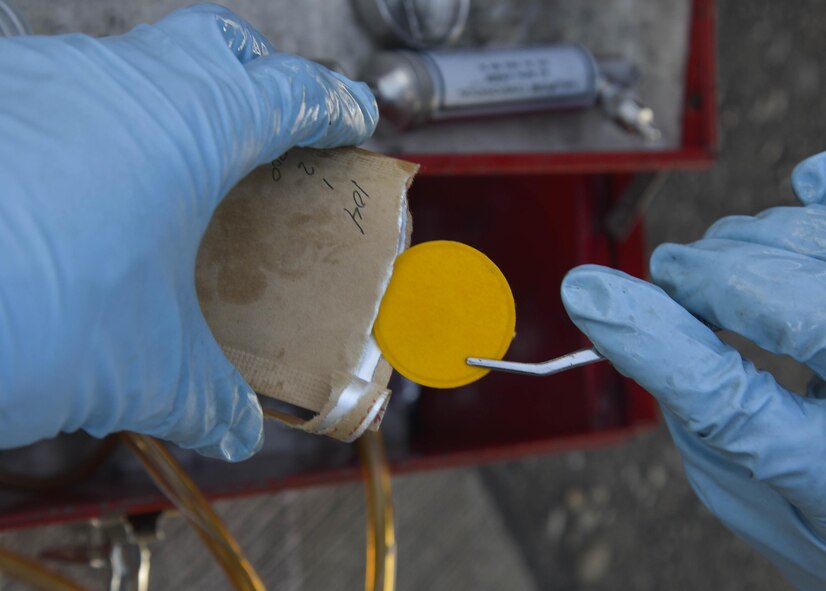 U.S. Air Force Senior Airman Daniel Shelly, 374th Logistics Readiness Squadron fuels management flight fuels laboratory supervisor, prepares a sample pad for a water test on a refueling unit at Yokota Air Base, Japan, Oct. 1, 2015. This test is performed monthly to ensure only good, clean and water-free fuel is issued to aircraft. (U.S. Air Force photo by Senior Airman David Owsianka/Released)