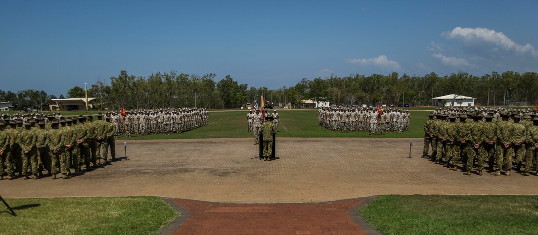 Australian Army Brig. Mick Ryan addresses U.S. Marines with 1st Battalion, 4th Marine Regiment, Marine Rotational Force – Darwin, and soldiers with 1st Brigade, Australian Army, Oct. 5 during a farewell ceremony hosted by 1 BDE at Robertson Barracks, Northern Territory, Australia. Ryan and U.S. Marine Corps Maj. Gen. Richard Simcock congratulated the Marines on their hard work and the amount of effort they’ve shown throughout their time partipating in training exercises, performing community services and immersing in Australian culture. The rotational deployment of U.S. Marines in Australia affords an unprecedented combined training opportunity with our allies and improves interoperability between our forces. Simcock is the commanding general of 3rd Marine Division, III Marine Expeditionary Force and Ryan is the commander of 1 BDE.