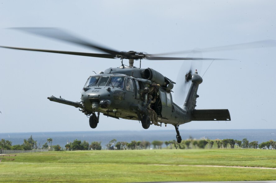 U.S. Air Force pararescuemen prepare to zipline from a helicopter October 3, 2015 on Kadena Air Base, Japan. These Airmen are part of a demonstration for Rescuefest, a yearly event that displays the capabilities of the 31st and 33rd rescue squadrons. (U.S. Air Force photo by Airman 1st Class Nicholas Emerick/Released)